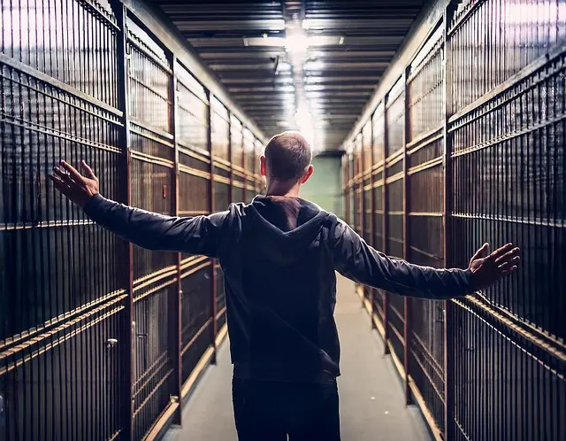 Image of walking down jailhouse corridor